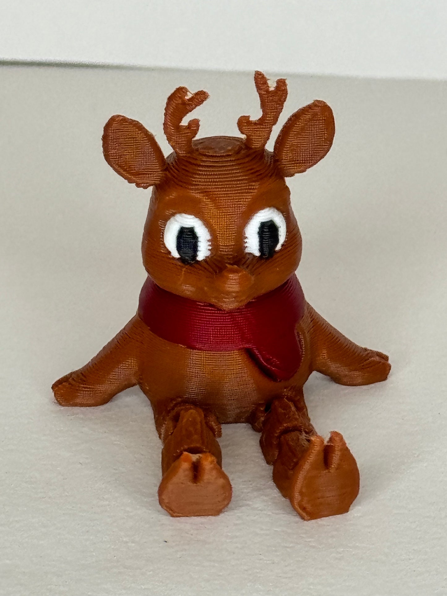 Mini Sitting Reindeer